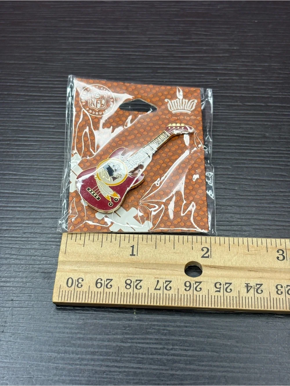 Vintage Washington Redskins guitar shaped lapel pin by Aminco. New old stock